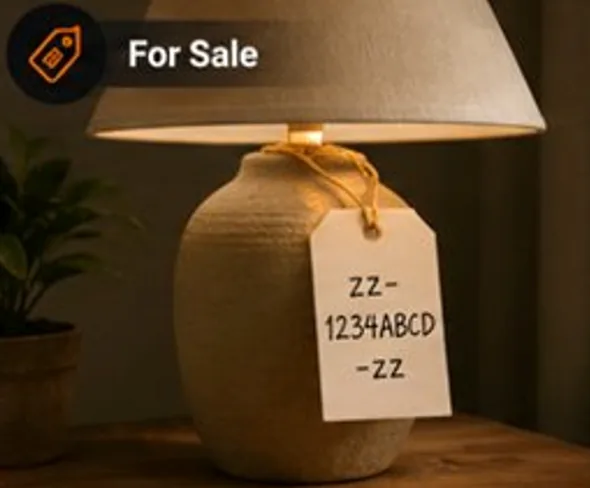 A table lamp with a handwritten paper tag reading zz-1234ABCD-zz, under a For Sale banner.